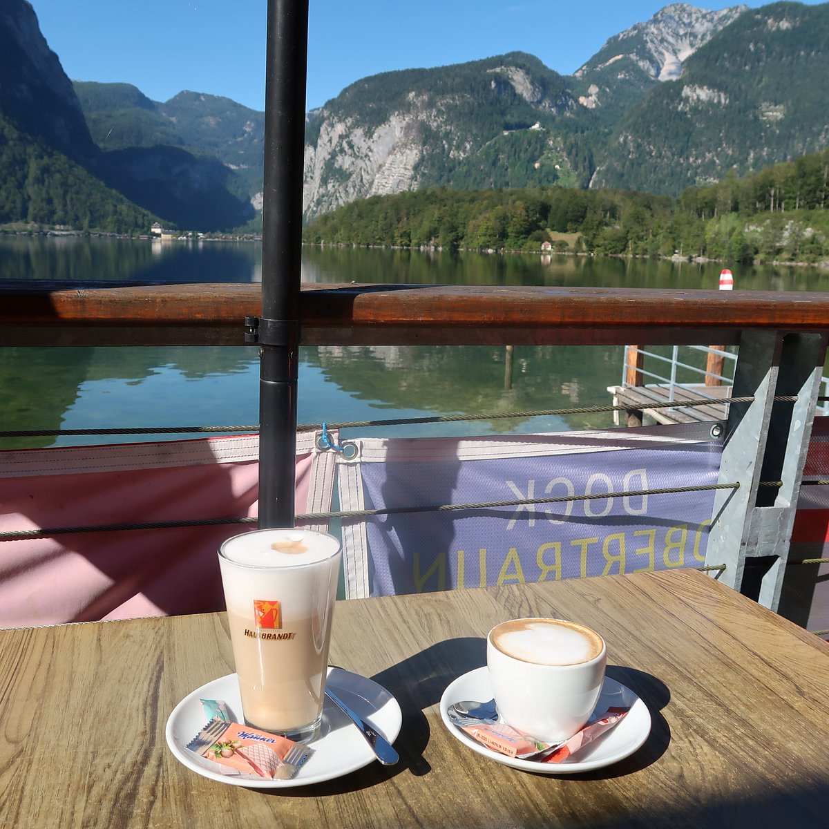 Coffee drinks served with a panoramic lake and mountain view